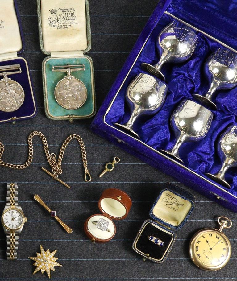 Cased silver goblets, medals and a pocket watch ready for auction